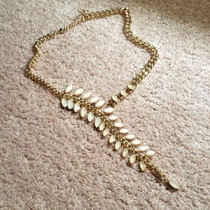 Gold colored chain with beige stones